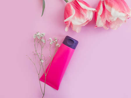 cream cosmetic flower tulip on colored backgroundの写真素材