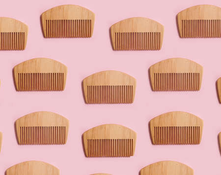 wooden comb on a colored backgroundの写真素材