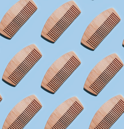 wooden comb on a colored background