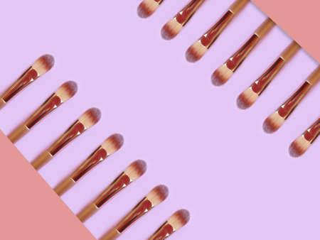 makeup brush on colored background
