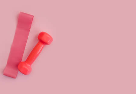 sports dumbbell on a colored background