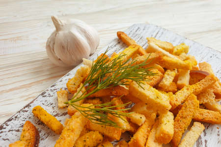 fried bread croutons on a wooden backgroundの写真素材