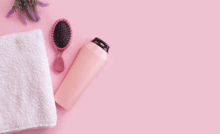 shampoo, towel comb on a colored backgroundの写真素材