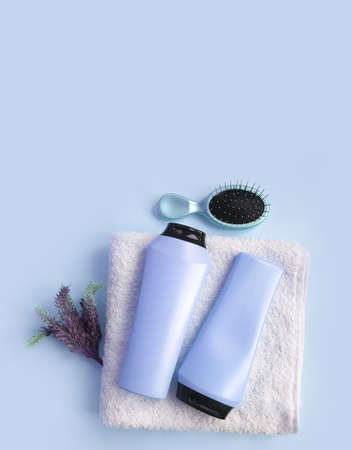 shampoo, towel comb on a colored backgroundの写真素材