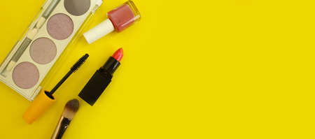 decorative cosmetics, mascara, lipstick,  on a colored backgroundの写真素材