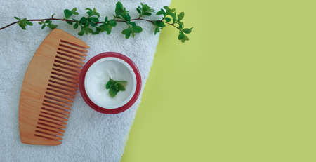 hair mask, wooden comb on a colored backgroundの写真素材