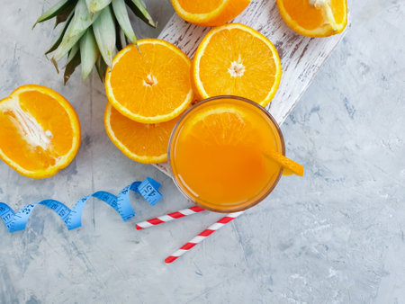 fresh juice, orange, pineapple on concrete backgroundの写真素材