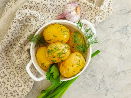 young boiled potatoes, dill background, garlicの写真素材