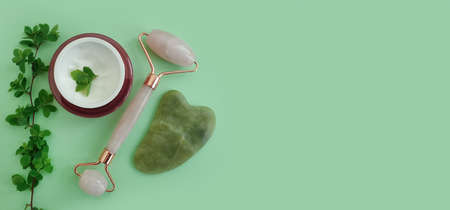 massage quartz roller, cream on colored backgroundの写真素材