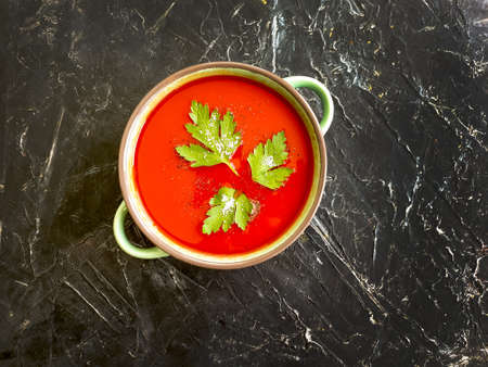 tomato soup on a concrete background