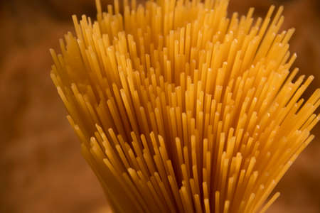 dry spaghetti on wooden backgroundの写真素材