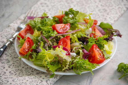 fresh vegetable salad on concrete backgroundの写真素材
