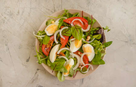 fresh organic vegetable salad on concrete backgroundの写真素材