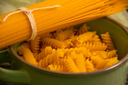 dry spaghetti on wooden background