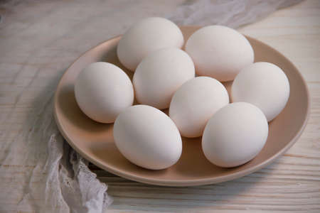 raw eggs on wooden backgroundの写真素材