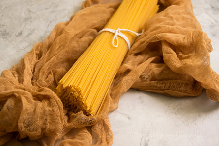 dry spaghetti on a concrete backgroundの写真素材