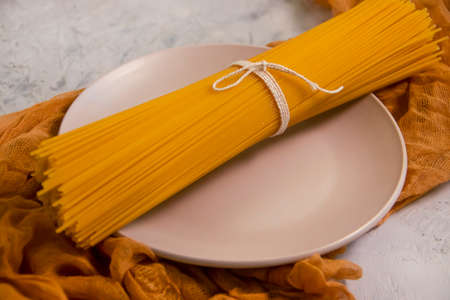 dry spaghetti on a concrete backgroundの写真素材