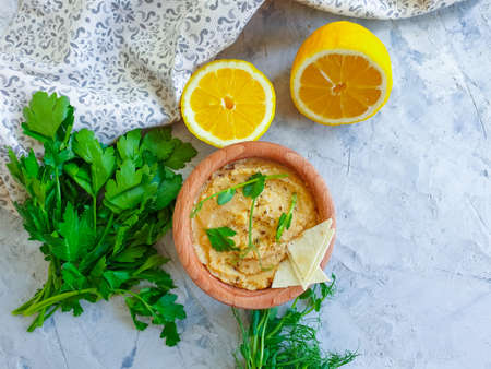 fresh hummus, greens on a concrete backgroundの写真素材