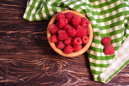 fresh raspberries on wooden backgroundの写真素材