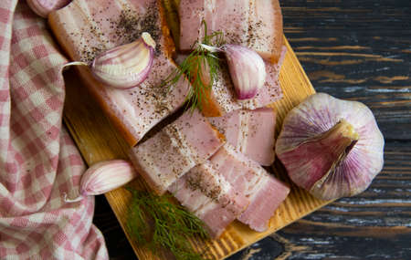 lard, garlic on wooden background