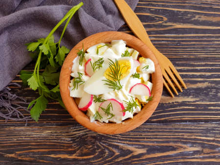 salad egg, radish, dill on wooden backgroundの写真素材
