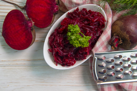 boiled grated beetroot on a wooden backgroundの写真素材