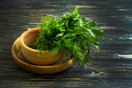 fresh parsley on wooden background natural vegetarianの写真素材