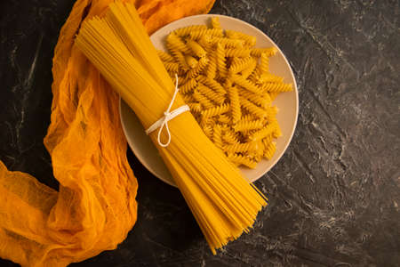 dry spaghetti, pasta on a concrete backgroundの写真素材