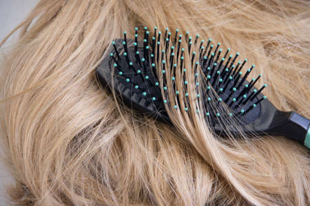 comb in natural beautiful hairの写真素材