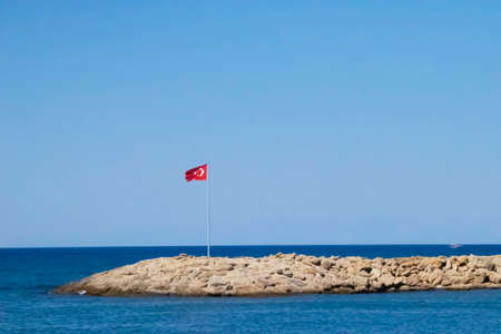 Turkey flag on sky backgroundの写真素材