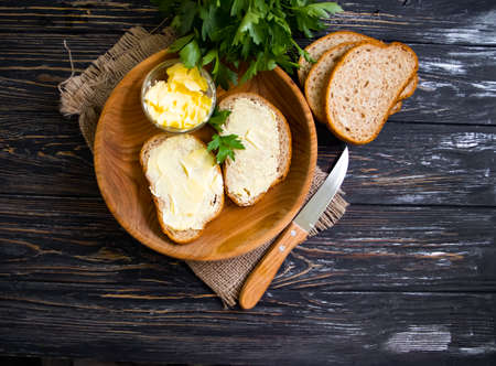 bread, butter on wooden backgroundの写真素材