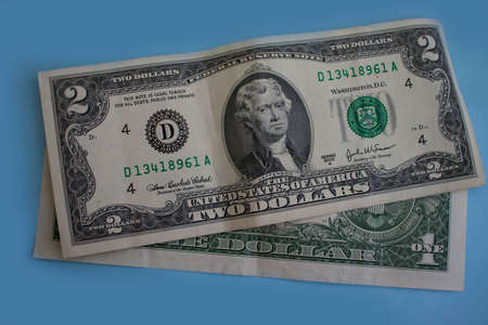 dollar bills on a colored backgroundの写真素材