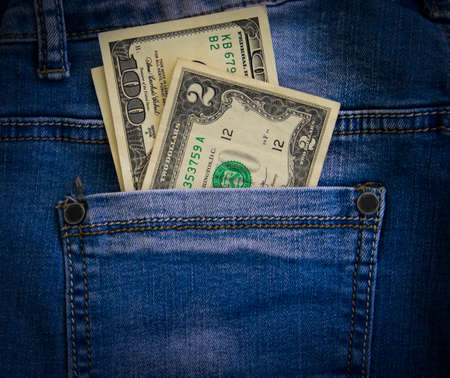 denim pocket, dollar bills background