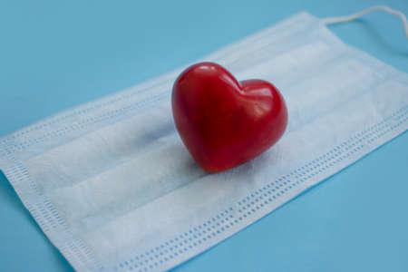 medical mask, heart on a colored backgroundの写真素材