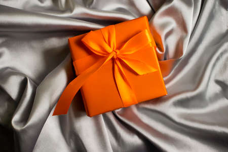 gift box on silk backgroundの写真素材