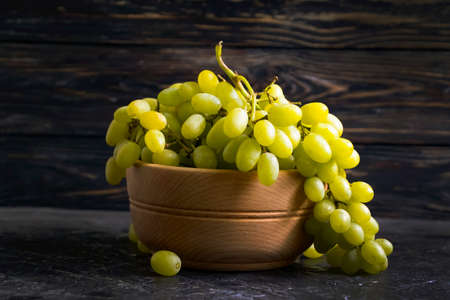fresh grapes on wooden backgroundの写真素材