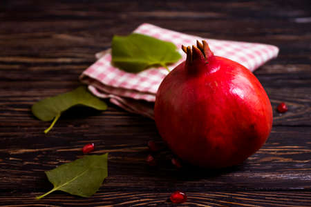 pomegranate fruit on wooden backgroundの写真素材