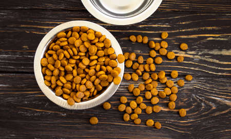 dry food for cats on a wooden backgroundの写真素材