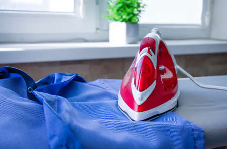 iron clothes on the blackboard at homeの写真素材