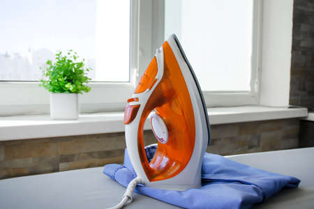 iron clothes on the blackboard at homeの写真素材