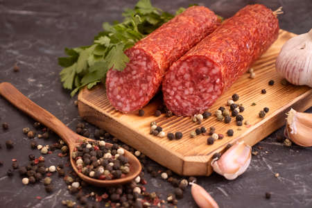 sausage salami, spices on concrete backgroundの写真素材