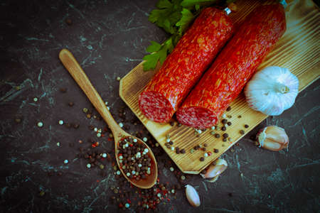 sausage salami, spices on concrete backgroundの写真素材