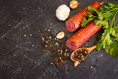 sausage salami, spices on concrete backgroundの写真素材