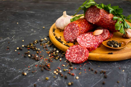 sausage salami, spices on concrete backgroundの写真素材