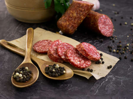 sausage salami, spices on concrete backgroundの写真素材