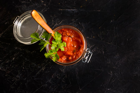 homemade tomato sauce on a concrete background