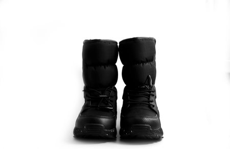 new winter boots on a white backgroundの写真素材