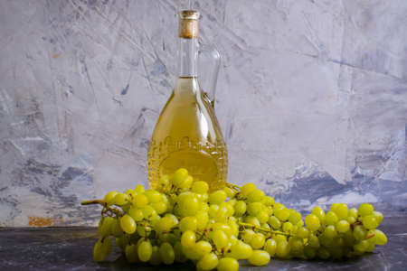 white wine bottle on a concrete backgroundの写真素材