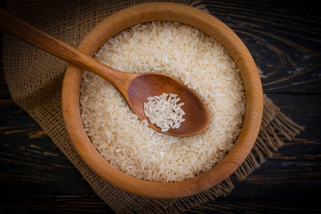 raw rice natural wooden plateの写真素材