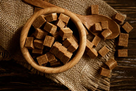 brown sugar cubes on a woodenの写真素材